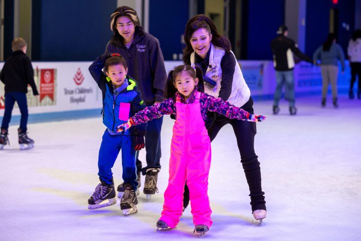 a little girl that is standing in the snow