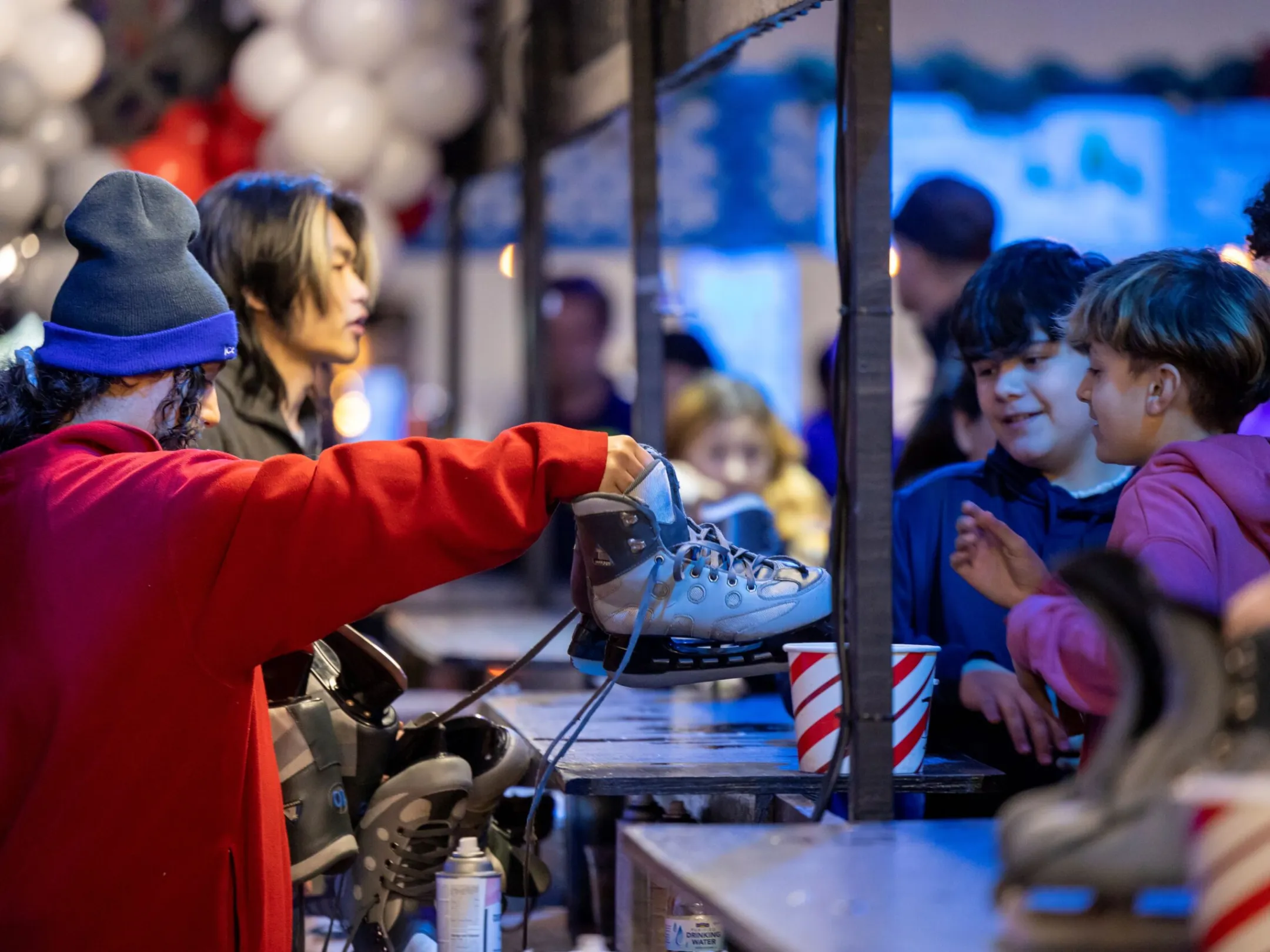 a group of people standing next to a child