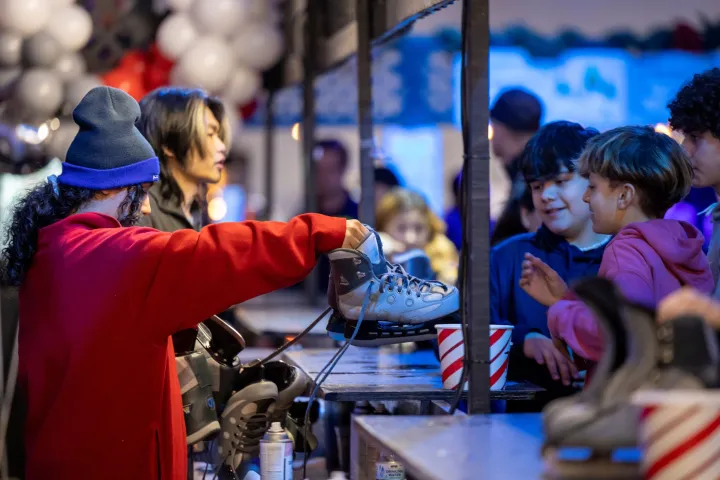 a group of people standing next to a child